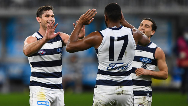 Tom Hawkins celebrates one of his four goals.