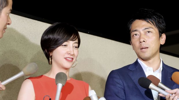 The paternity leave plans of Environment Minister Shinjiro Koizumi, right, who is married to TV personality Christel Takigawa, left, have caused a media stir.