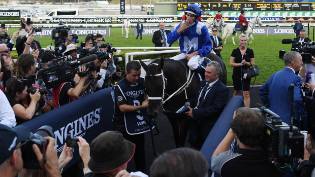 The crowd shows its appreciation of Winx and Hugh Bowman.