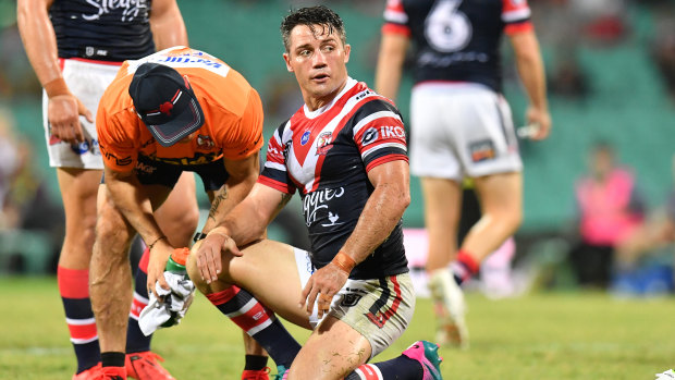 Tough hit: Cooper Cronk was on the wrong end of a knock from Broncos wrecking ball Tevita Pangai jnr.