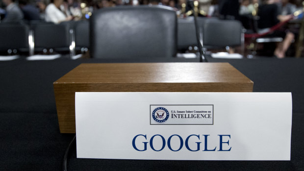 An empty chair reserved for Google's parent Alphabet, which refused to send its top executive.