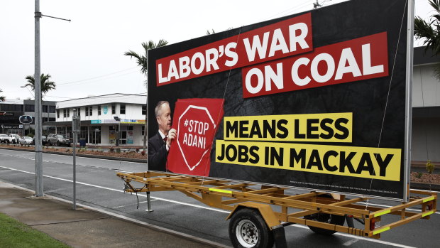 A billboard parked at the pro-Adani rally in Mackay featured a misleading, cropped photograph of Bill Shorten.