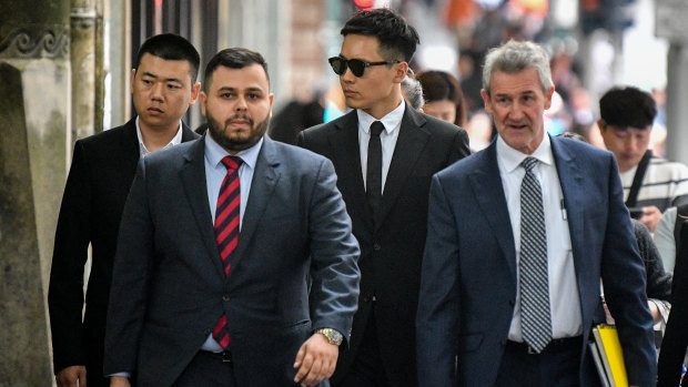 Chinese actor Yunxiang Gao (centre) arrives at court on Wednesday. 