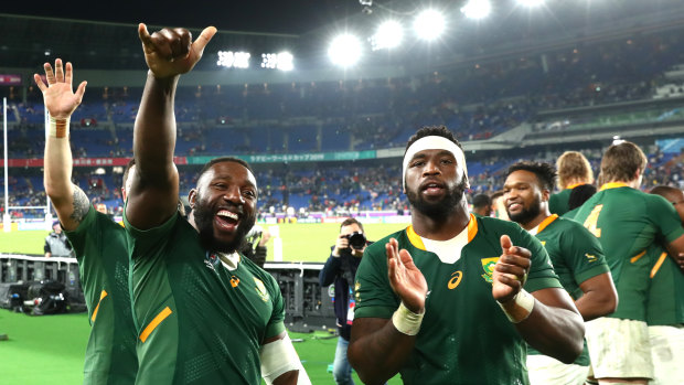 Prop Tendai Mtawarira and captain Siya Kolisi celebrate South Africa's semi-final win over Wales 
