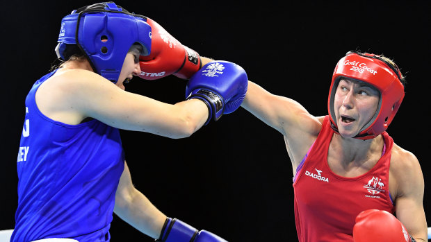 Anja Stridsman sends out a right against Paige Murney of England in the womens 60kg boxing final at the Oxenford Studios on the Gold Coast.