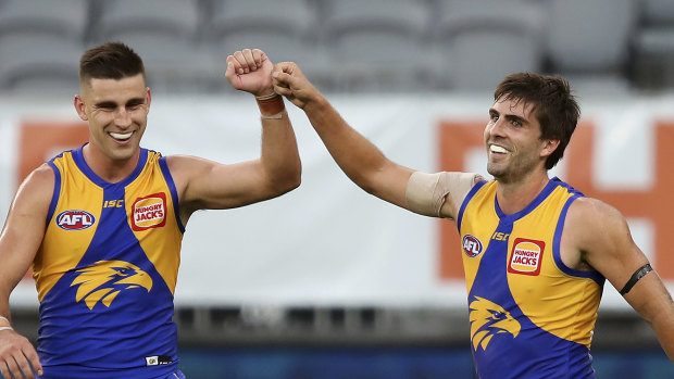 Elliot Yeo congratulates Andrew Gaff on kicking a goal in round 1 at Optus Stadium. The Eagles won't play a fixture on their home turf for some time.