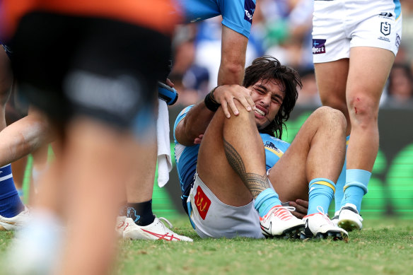 Tino Fa’asuamaleaui holds his knee after suffering an ACL rupture at Belmore Oval.