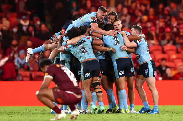 NSW celebrate their series-clinching win in Brisbane as a dejected Felise Kaufusi wonders what might have been.