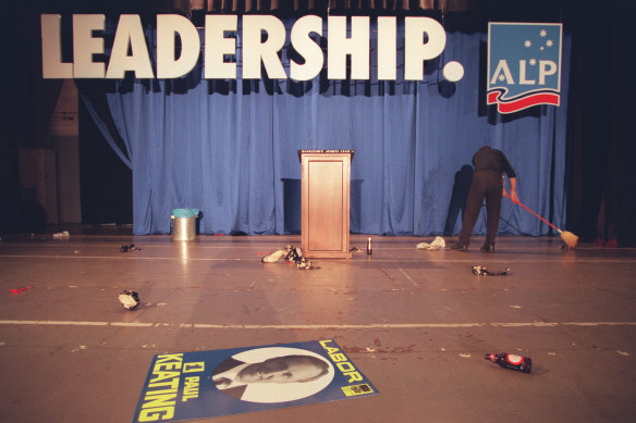Landslide loss: a cleaner sweeps the stage at Bankstown Sports Club in the early hours of the morning on March 3, 1996.
