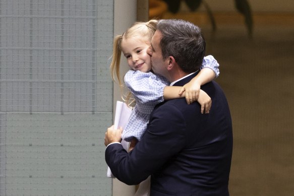 Treasurer Dr Jim Chalmers with his daughter after delivering the budget speech.