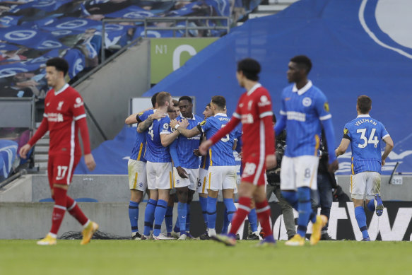Pascal Gross and his Brighton teammates celebrate his equaliser against Liverpool.