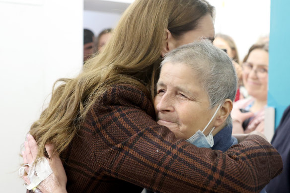 Catherine hugs Rebecca Mendelhson during her visit.