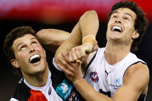 Rowan Marshall, left, compete for the ball against Jack Silvagni in round 20. 