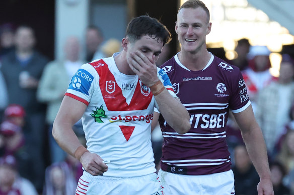 Dragons five-eighth Kyle Flanagan is chipped by Manly’s daly Cherry-Evans after being sent for a concussion test.