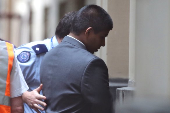 James Stoneham is led into the Supreme Court in 2013.