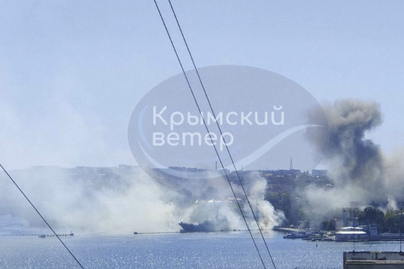 An image taken from UGC video shows smoke rising from the headquarters of Russia’s Black Sea Fleet in Sevastopol, Crimea, Friday.