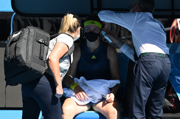 The medicos attend to Karolina Muchova on-court.