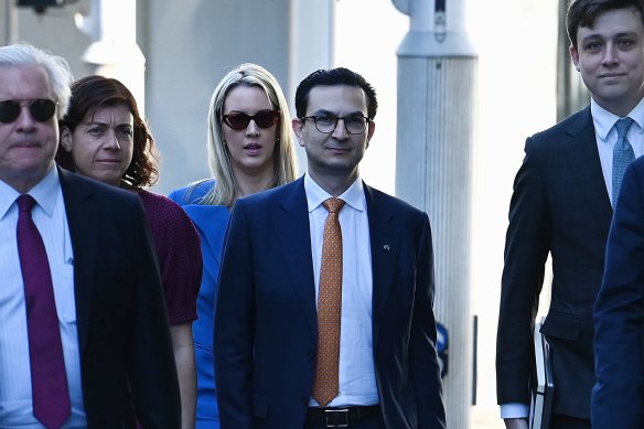 Surgeon Munjed Al Muderis (centre) with his legal team.