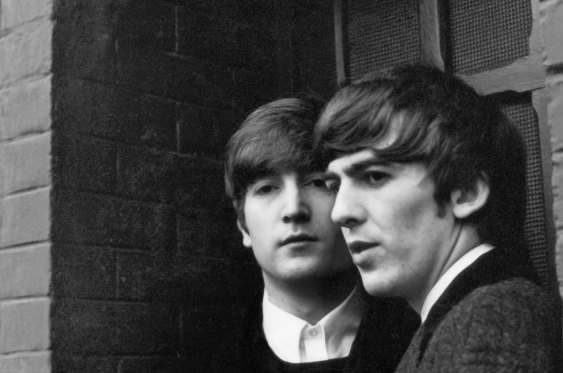 John Lennon and George Harrison in Paris, February 1964.