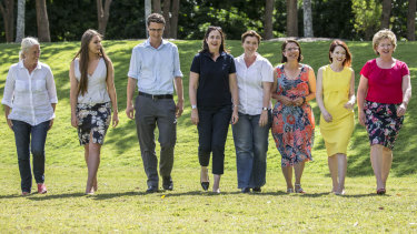 Annastacia Palaszczuk (fourth from right) with winning Labor candidates (left to right) Kim Richards (Redlands), Meaghan Scanlon (Gaven), Bart Mellish (Aspley), Melissa McMahon (Macalister), Charis Mullen (Jordan), Jess Pugh (Mount Ommaney) and Corinne McMillan (Mansfield)  at Seventeen Mile Rocks on Sunday.