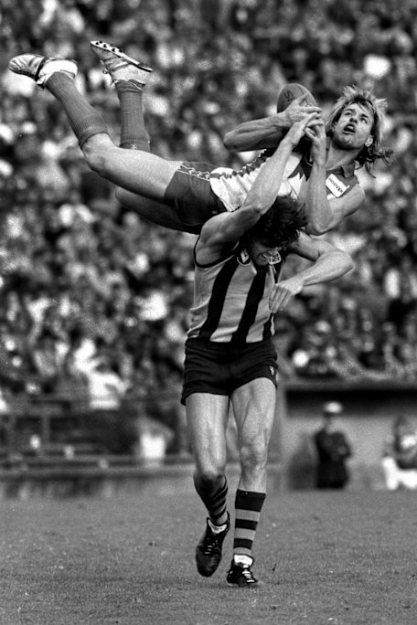 Highlight: Warwick Capper flies high over Chris Langford in the 1987 finals.