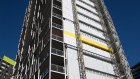 Coming off: Cladding rectification underway in Sydney’s Pyrmont. 