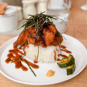 Musubi topped with panko-crumbed, deep-fried chicken.