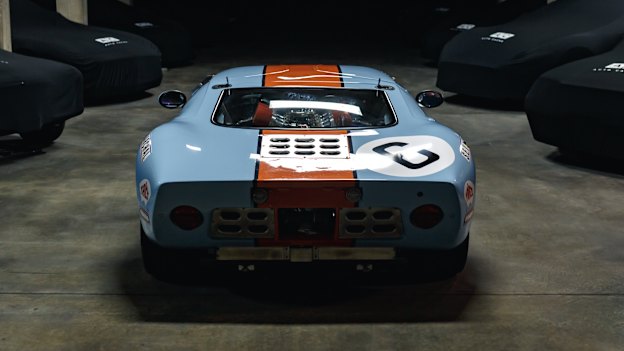 A blue and orange Ford GT40 sits in storage at the top-secret Auto Cache facility. 