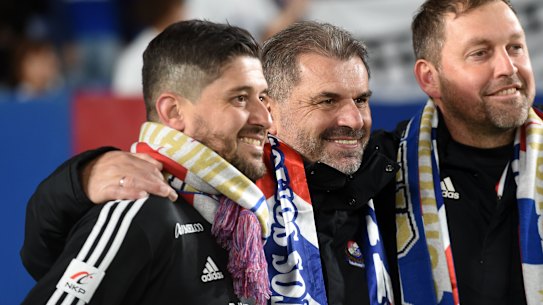 Peter Cklamovski celebrates Yokohama F. Marinos' title win last season with Ange Postecoglou and Peter Cklamovski, who now coaches Japanese rivals Shimizu S-Pulse.