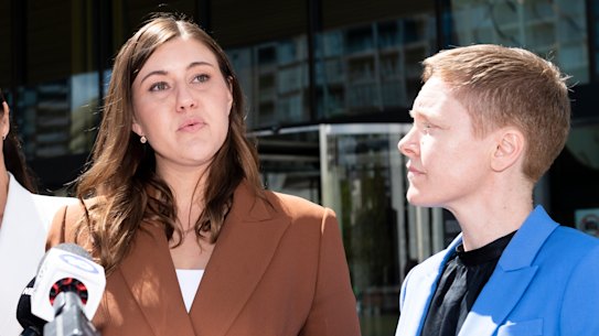 Brittany Higgins, centre, spoke outside the ACT Supreme Court after the first trial was aborted, with Heidi Yates standing on the right.