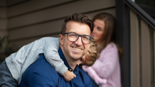 Glen Iris sales manager Phil Heys, with his son Harry (and wife Kat and baby Rosie in the background). Hopes to keep doing some work from home after the pandemic passes.