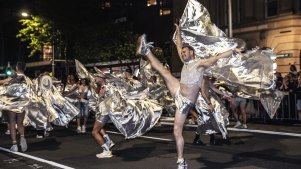 Dancers high-kick down Oxford Street in the 2024 Mardi Gras parade.