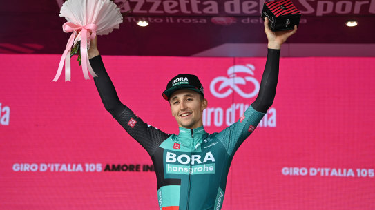 Jai Hindley celebrates on the podium after winning the ninth stage of the Giro d’Italia.