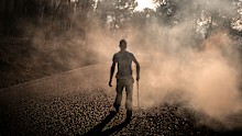A man works to extinguish hot spots in an area burned by a wildfire near Casavieja, Ávila province, Spain.