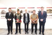 Baruch (left) welcomes officials including German ambassador to Indonesia, Ina Lepel (centre), to the photo exhibition last month.