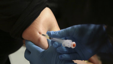 A woman receives a measles, mumps and rubella vaccine at the Rockland County Health Department on Wednesday.