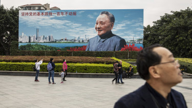 A billboard featuring an image of China's former leader Deng Xiaoping is part of celebrations marking the 40th anniversary of market reforms.
