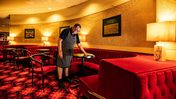 Reta Lusher, dusting off the tables at the  Commercial Travellers Association for Sydney Festival.