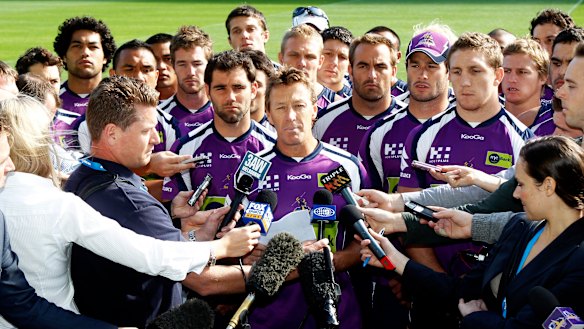 Craig Bellamy reads a statement in front of Melbourne players in 2010 after the salary cap penalties were announced.