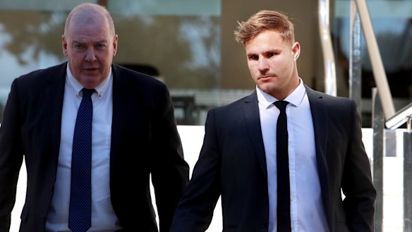 Jack de Belin (right) outside Wollongong Local Court in August.