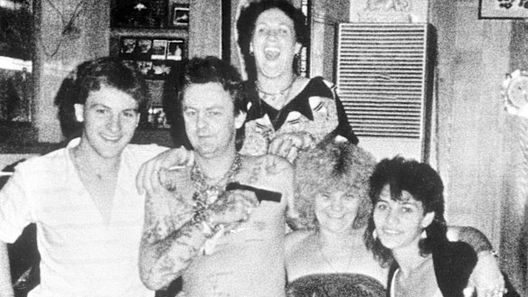 Happy families: Drug dealer and multiple murderer Dennis Allen points a gun at his mother Kath Pettingill's head.