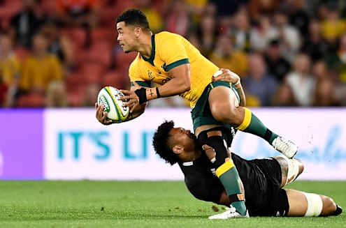 Hunter Paisami of the Wallabies is tackled during the 2020 Tri-Nations match between the Australian Wallabies and the New Zealand All Blacks at Suncorp Stadium.