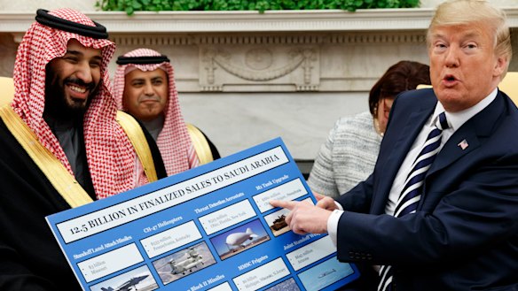 US President Donald Trump holds a chart highlighting arms sales to Saudi Arabia during a meeting with Saudi Crown Prince Mohammed bin Salman in the Oval Office in March.