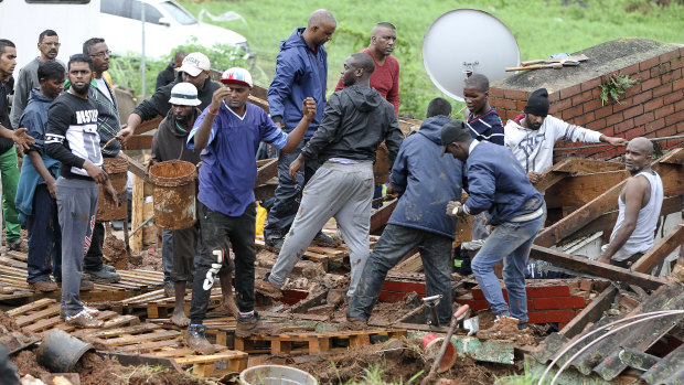 Rescue workers search for victims in a collapsed building near Durban, South Africa. 