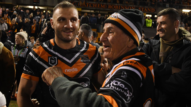 Play it again, Dad ... Peter Farah helped out with the Wests Tigers team song afterwards.