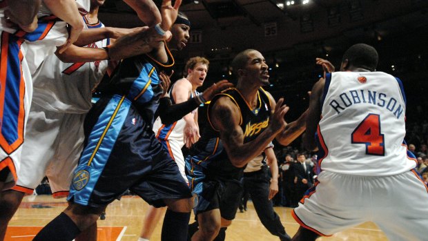 Robinson and Smith go at it as Carmelo Anthony is held back.