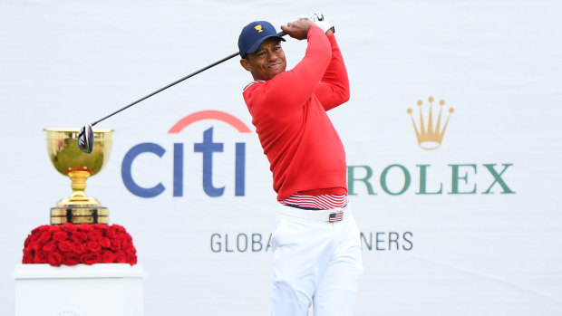 Tiger Woods registered the United States' first point of the Presidents Cup after combining with Justin Thomas on Thursday.