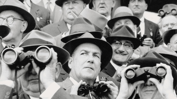 A time when hats and binoculars were an essential part of a male racegoer's gear, 1959 Melbourne Cup.