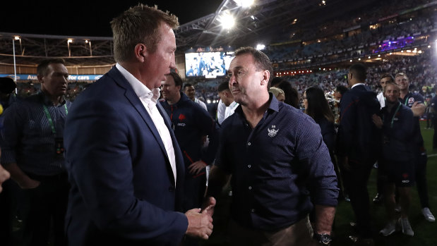 Roosters coach Trent Robinson and Raiders coach Ricky Stuart chat after last year's grand final.