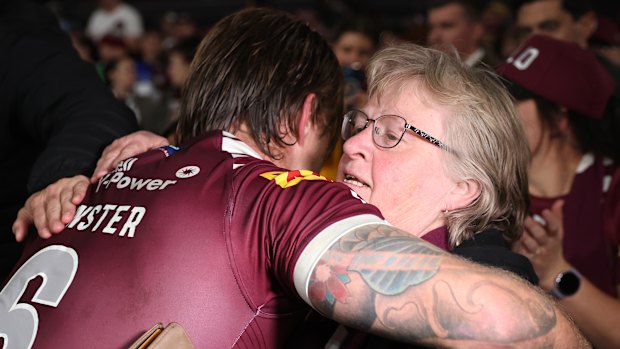Cameron Munster hugs his mother, Deborah, after the Origin decider.